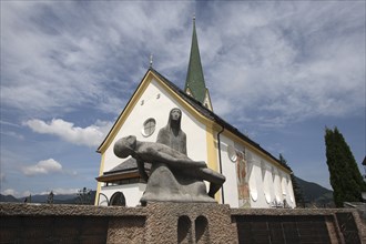 Pieta statue outside church.