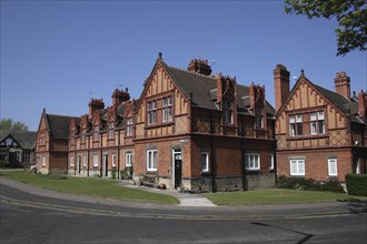 Red brick terraced houses on Cross street.
