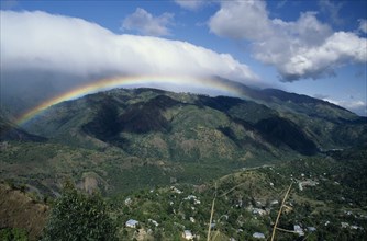 West Indies, Jamaica , Blue Mountains, Mountain landscape with rainbow and drifts of cloud. Photo :