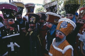 Mexico, Morelos, Cuernavaca, La Festa de la Asoncion de Maria. Masked group outside Cuernavaca