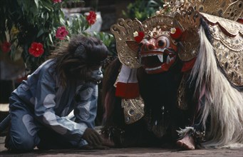 Indonesia, Bali, Barong dance representing the struggle between good and evil. Monkey removes thorn