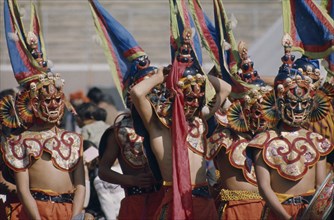 Bhutan, Festivals, Bhutanese masked dancers. Photo : Hutchison