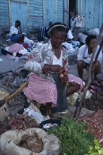 Dominican Republic, Markets, Vegetable stall holder in market. Photo : Nancy Durrell McKenna