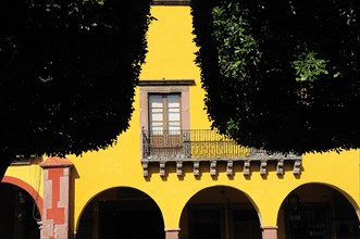 Mexico, Bajio, San Miguel de Allende, El Jardin Detail of yellow painted facade of colonial mansion