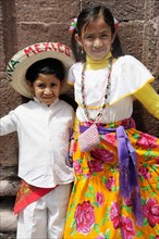Mexico, Bajio, San Miguel de Allende, Two young children dressed for Independence Day celebrations.