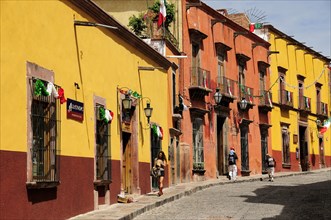 Mexico, Bajio, San Miguel de Allende, Independence Day decorations adorn colonial streets lined by