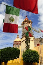 Mexico, Bajio, San Miguel de Allende, Mexican flags and Independence Day decorations hang in