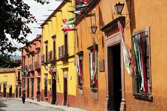 Mexico, Bajio, San Miguel de Allende, Independence Day decorations adorn colonial street lined with