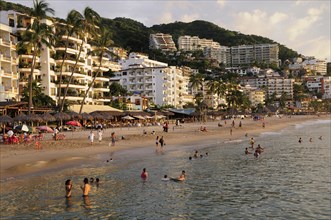 Mexico, Jalisco, Puerto Vallarta, View of Playa Los Muertos beach overlooked by hotels and