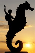 Mexico, Jalisco, Puerto Vallarta, Caballeo del Mar sculpture of boy riding a seahorse by Rafel