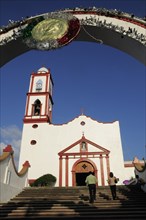 Mexico, Veracruz, Papantla, Cathedral de la Asuncion white and red painted exterior bell tower and