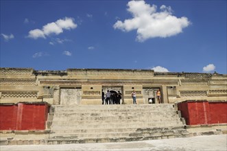 Mexico, Oaxaca, Mitla, Archaeological site Templo de las Columnas with tourist visitors standing at