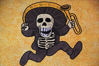 Mexico, Bajio, Queretaro, Wall art depicting skeleton in sombrero holding a trumpet. Photo : Nick