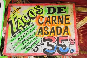 Mexico, Bajio, Zacatecas, Sign for taco food stall with highlighted text and price. Photo : Nick