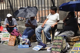 Mexico, Federal District, Mexico City, Workers plying trade outside the Cathedral in the Zocalo