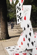 Mexico, Federal District, Mexico City, Bench designed as pack of falling cards on the Paseo de la