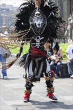 Mexico, Federal District, Mexico City, Michicoa Aztec dancer dressed in costume of Senor de Muerte