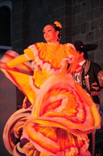 Mexico, Jalisco, Guadalajara, Plaza Tapatia Folk dancer from Jalisco State dancing at carnival..