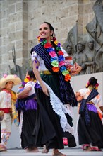 Mexico, Jalisco, Guadalajara, Plaza Tapatia Woman folk dancer from Guerrero State performing in