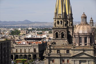 Mexico, Jalisco, Guadalajara, View of Cathedral dome and twin spires with city to the north and