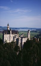 Germany, Bayern, Allgau, Fussen. Schloss Neuschwanstein Castle with Forggensee Lake in the