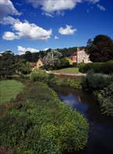 England, Hereford, Mordiford, House and gardens overlooking the River Lugg at Mordiford village in