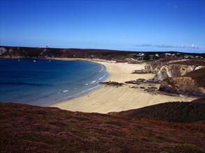 France, Bretagne, Crozon Peninsula, Veryach Beach. Stretch of sandy beach with three figures.