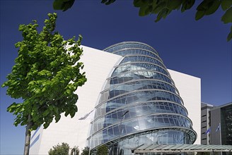 Ireland, County Dublin, Dublin City, Convention Centre building view of the facade with tree in