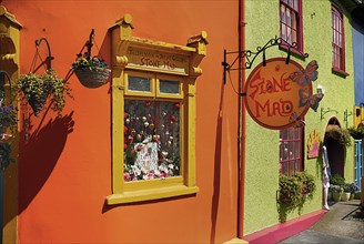 Ireland, County Cork, Kinsale, Colourful facades in market place with flower pots. Photo : Hugh