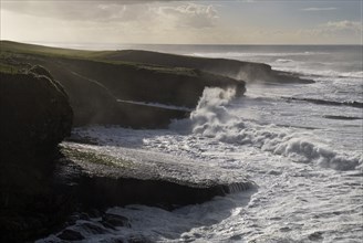Ireland, County Sligo, Mullaghmore, High waves crashing against headland. Photo : Hugh Rooney