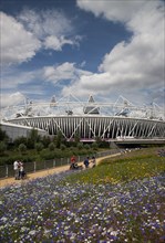 England, London, Stratford View of the 2012 Olympic Stadium with meadow planting in the foreground.
