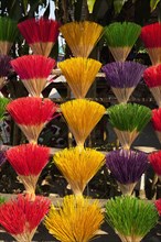 Vietnam, Thuy Zuan Hat village, Colourful bundles of incense sticks for sale. Photo : Mel Longhurst