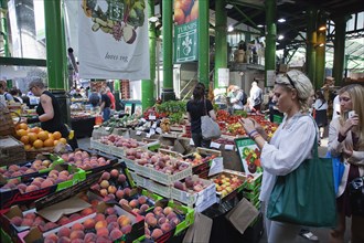 England, London, Borough Market Londons oldest fresh fruit and vegetable market Tourist taking