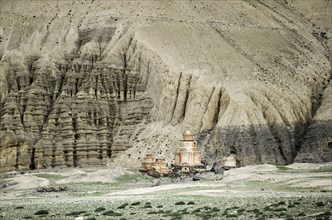 Nepal, Upper Mustang, Dhakmar, Distant Gompas and eroded rocks near Dhakmar village. Photo : Sergey