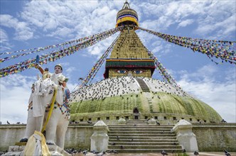 Nepal, Kathmandu, Boudhanath Stupa Five-color prayer flags and symbolic sculptures with mantras.