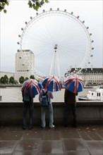 England, London, View across the River Thames during a rainy day toward the London Eye on the