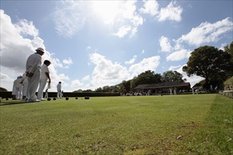 England, East Sussex, Uckfield, People playing flat lawn bowls at local club. Photo : Sean Aidan