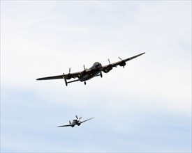 England, East Sussex, Beachy Head, Lancaster Bomber and Spitfire taking part in the Airbourne air