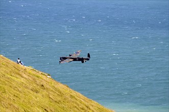 England, East Sussex, Beachy Head, Lancaster bomber taking part in the Airbourne air show. Photo :