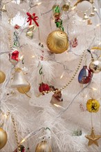 Festivals, Religious, Christmas, Detail of tree decorated with lights tinsel and various baubles.