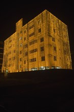 Bangladesh, Dhaka, Gulshan Apartment block at night lit up for a wedding with strings of fairy