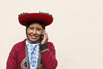 Peru, Indigenous People, Young woman using a Cell Phone. 
Photo Richard Rickard / Eye Ubiquitous