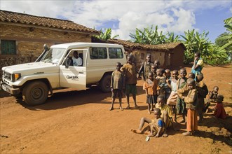 Rwanda, Children, Group of children on road beside a development project vehicle. 
Photo Nic I