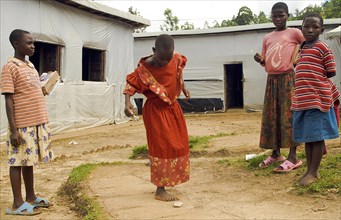 Burundi, Cibitoke Province, Mabayi, Primary School Girls playing hopscotch beside the Catch-up