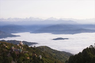 Nepal, Nagarkot, View across clouded valley towards Himalayan mountains. 
Photo Nic I Anson / Eye