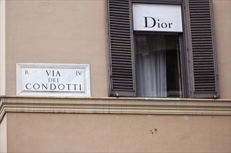 Italy, Lazio, Rome, Via del Condotti Street sign on the Christian Dior shop next to the Spanish