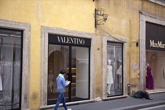 Italy, Lazio, Rome, Via del Condotti Exterior of the Valentino designer clothing shop with woman