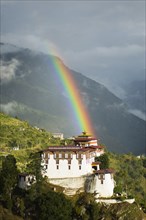 Bhutan, Lhuentse Dzong, Bhutan  Lhuentse Dzong with colourful rainbow overhead.