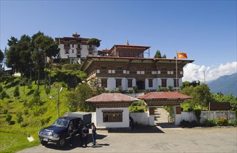 Bhutan, Zhemgang Dzong , Zhemgang Dzong with Police parked at entrance. 
Photo Nic I'Anson