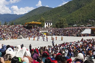Bhutan, Thimpu Dzong, Dancers in the courtyard during festival. 
Photo Nic I'Anson